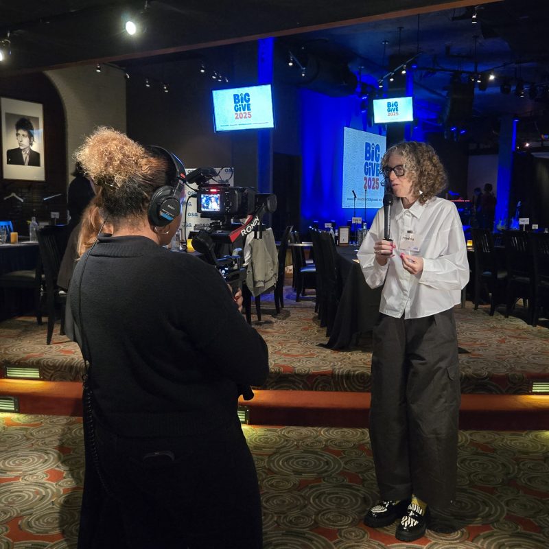 Professional event video production team filming a conference in Washington DC, capturing keynote speakers, audience engagement, and corporate event highlights.