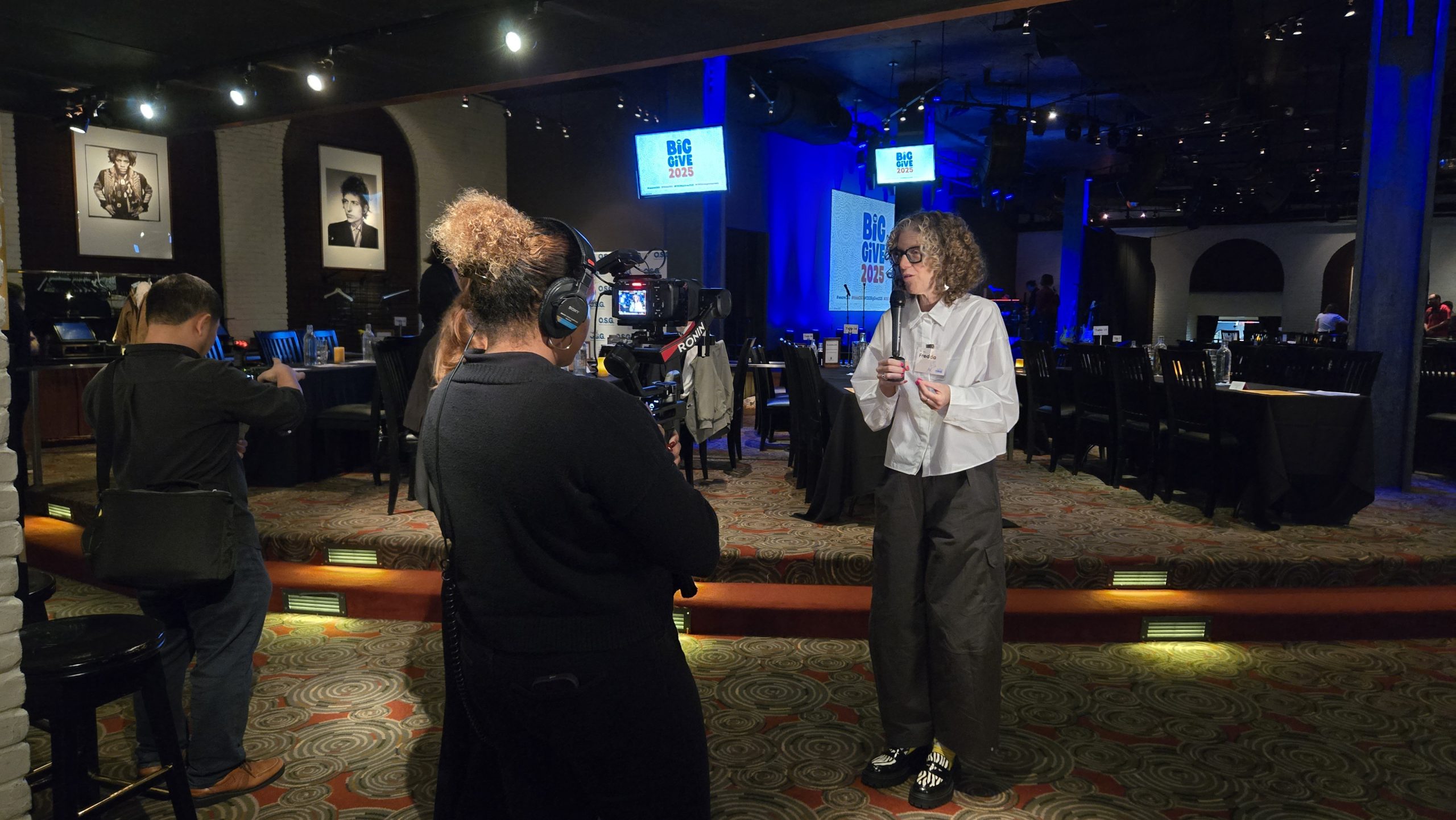 Professional event video production team filming a conference in Washington DC, capturing keynote speakers, audience engagement, and corporate event highlights.